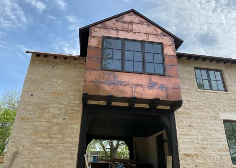 Copper metal panel facade on a stone building for Skylight Installation in Roanoke